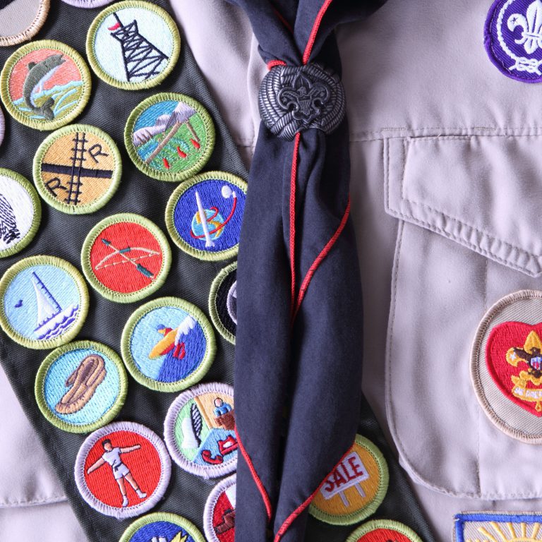 boy-scout-shirt-with-rank-badge-and-merit-badges-459028801-5ba41607c9e77c0050e259a6
